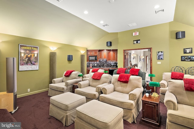 carpeted cinema featuring vaulted ceiling