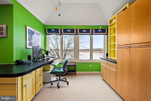 office space featuring lofted ceiling and light carpet