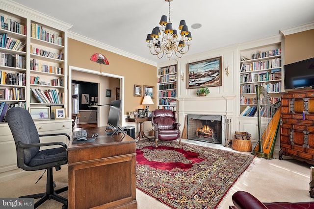 carpeted office space featuring crown molding, a fireplace, built in shelves, and a notable chandelier