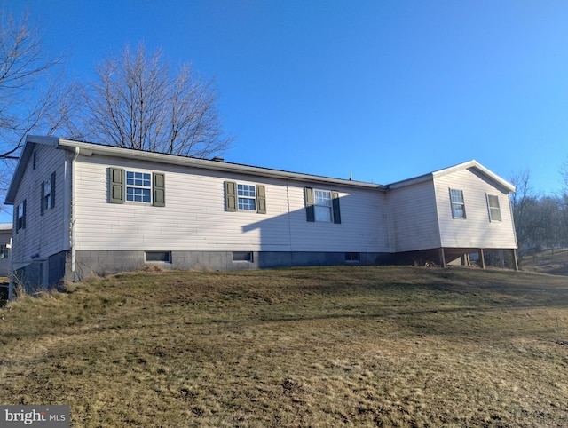 view of home's exterior with a yard