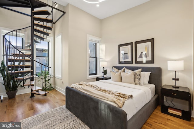 bedroom with wood-type flooring