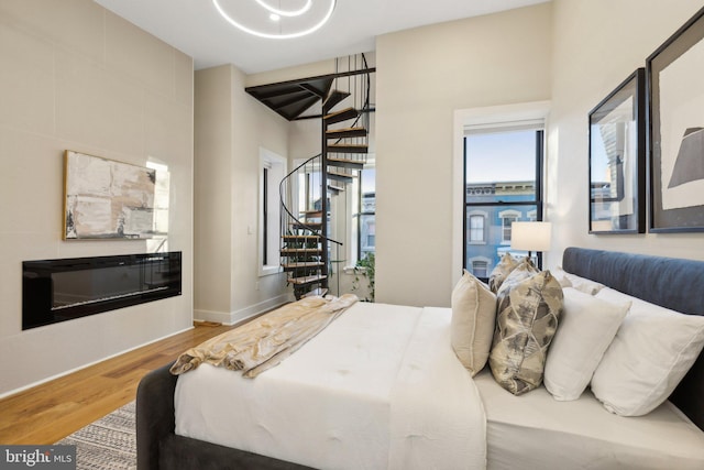 bedroom with hardwood / wood-style floors