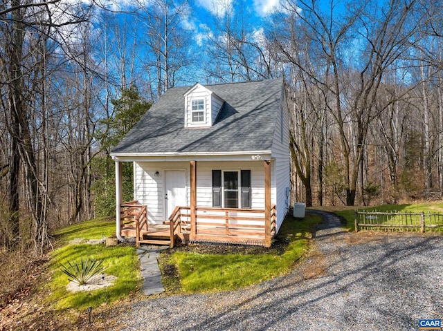 cape cod-style house featuring a porch