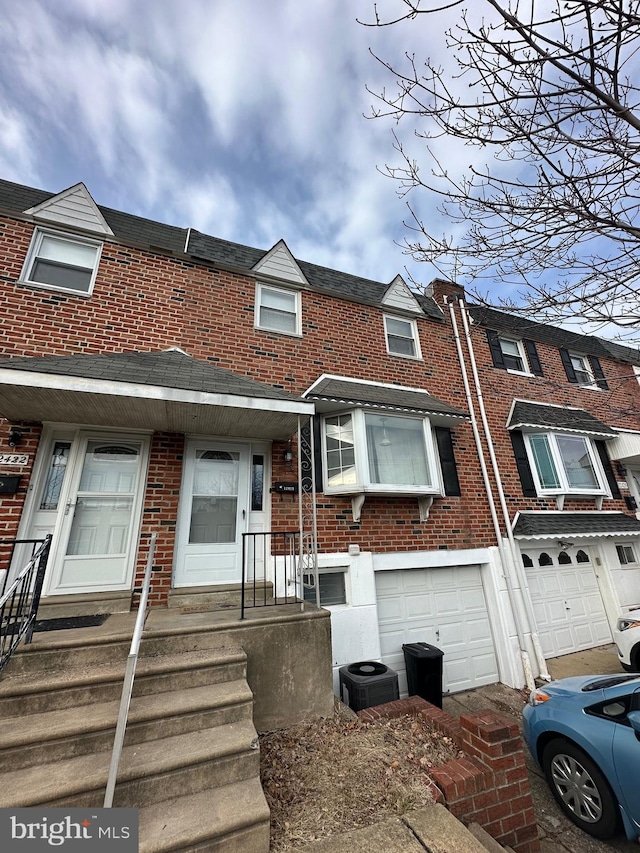 multi unit property with a garage and cooling unit