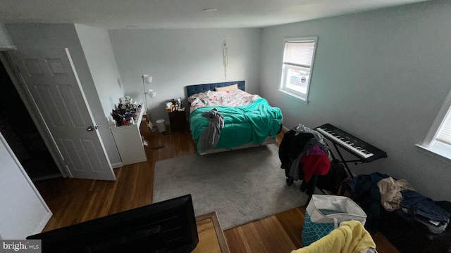 bedroom with hardwood / wood-style floors