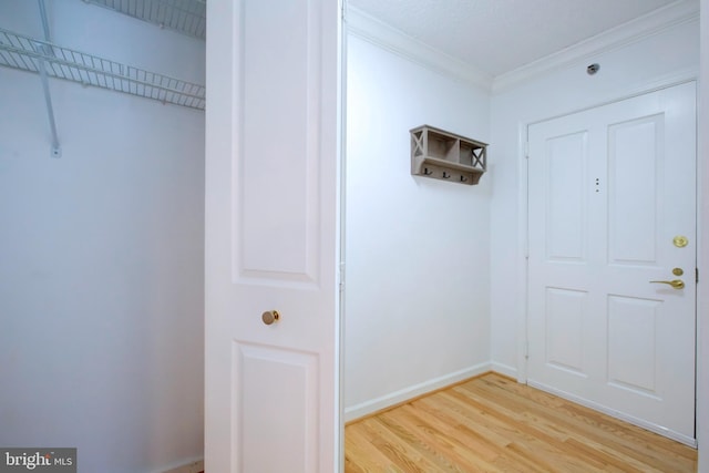 interior space featuring crown molding and hardwood / wood-style flooring