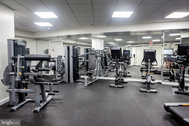 gym featuring a drop ceiling