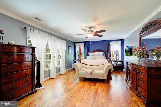 bedroom featuring ornamental molding, ceiling fan, and light wood-type flooring