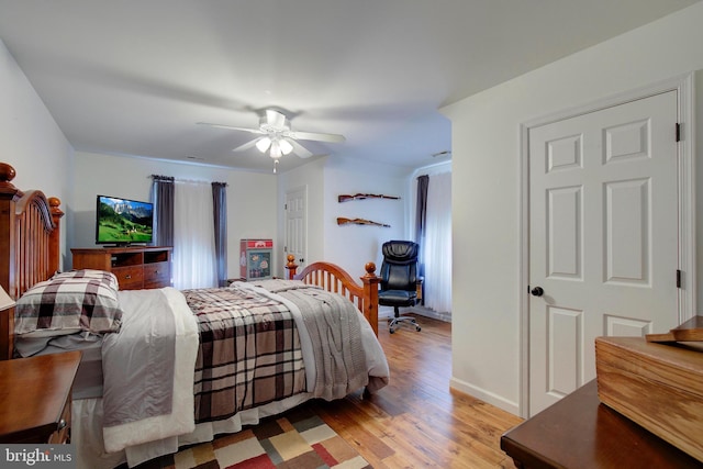 bedroom with ceiling fan and light wood-type flooring