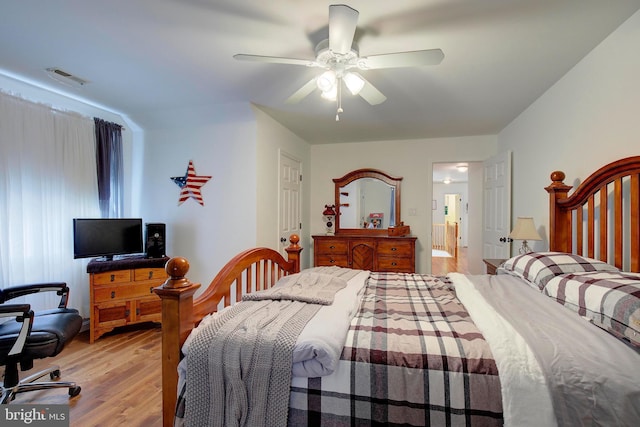 bedroom with ceiling fan and light wood-type flooring