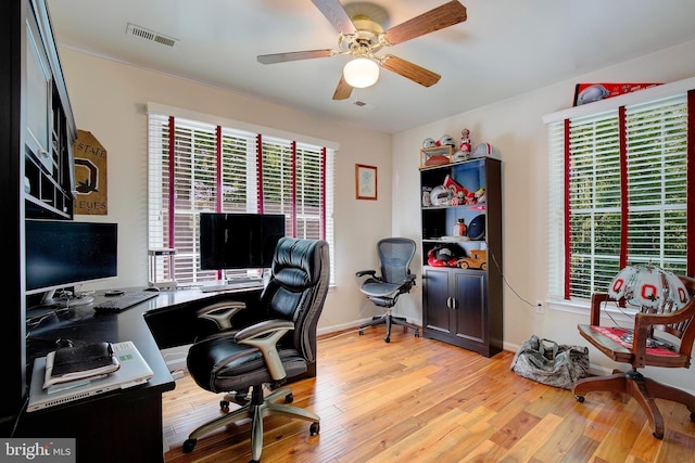 office with ceiling fan, a healthy amount of sunlight, and light wood-type flooring