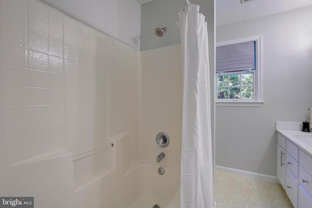 bathroom with tile patterned flooring, vanity, and shower / tub combo