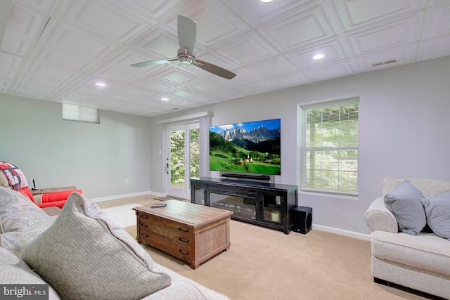 carpeted living room featuring ceiling fan