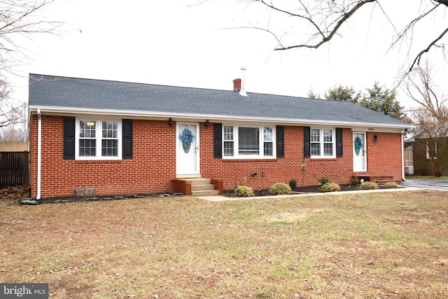 ranch-style house featuring a front yard