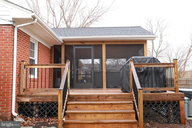 entrance to property with a wooden deck