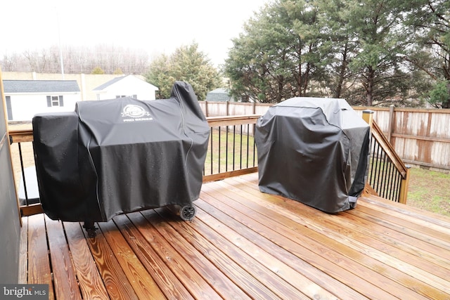 wooden deck featuring area for grilling