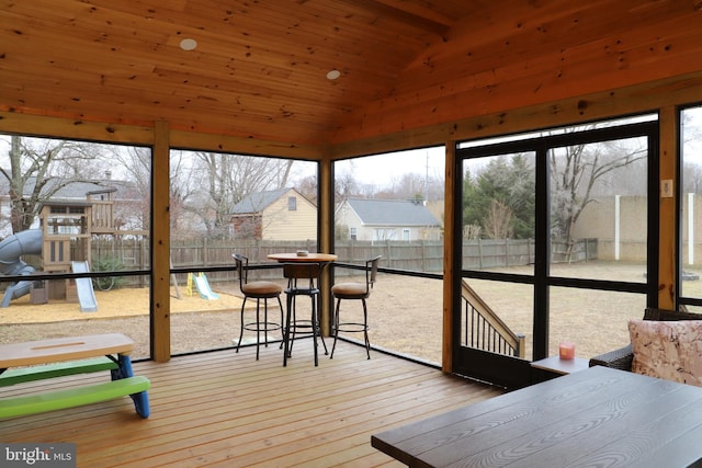 sunroom / solarium with lofted ceiling and wood ceiling