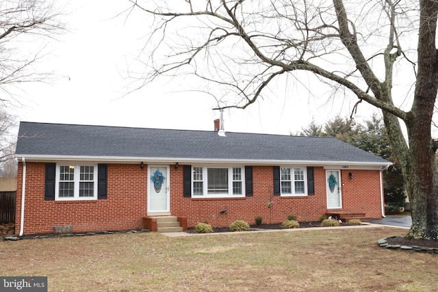 single story home featuring a front yard