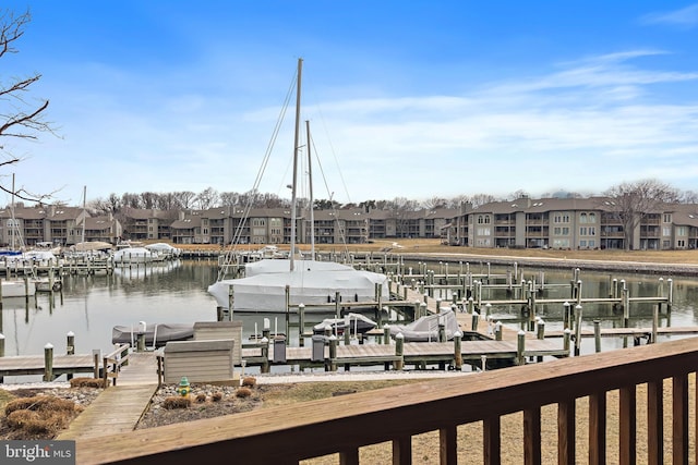 dock area featuring a residential view, a water view, and boat lift