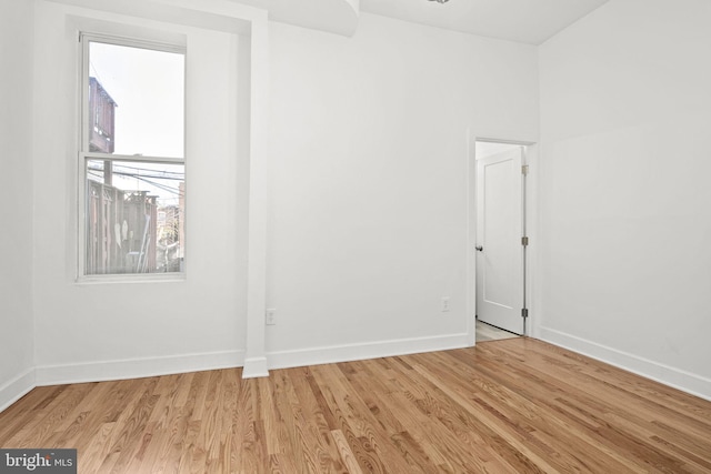 spare room with light wood-type flooring