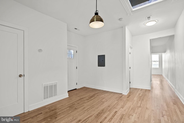 entryway with electric panel and light wood-type flooring