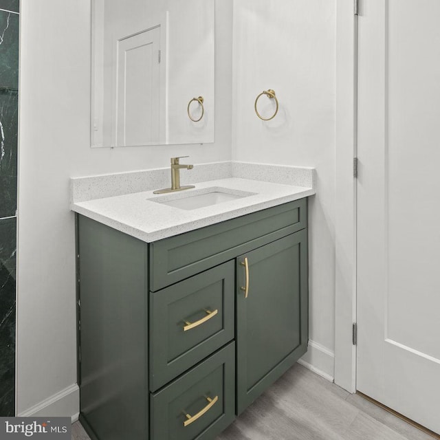 bathroom featuring vanity and hardwood / wood-style floors