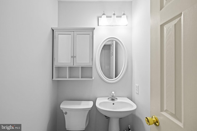 bathroom featuring sink and toilet