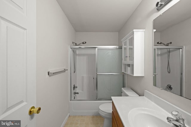 full bathroom with vanity, toilet, and combined bath / shower with glass door