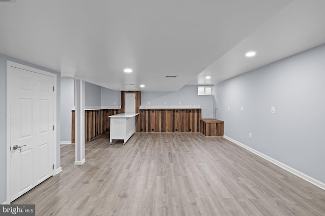 basement with light wood-type flooring