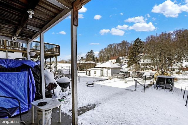 view of yard layered in snow