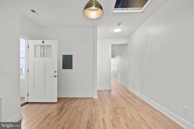 entryway with electric panel and light wood-type flooring