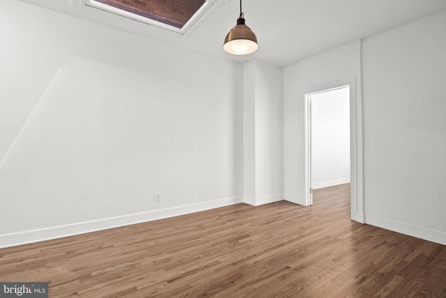 empty room with hardwood / wood-style floors