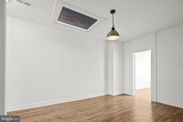 empty room featuring wood-type flooring