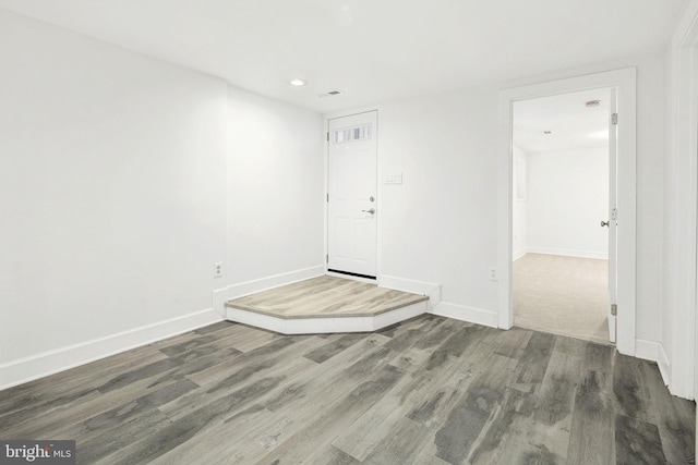 spare room featuring dark hardwood / wood-style floors