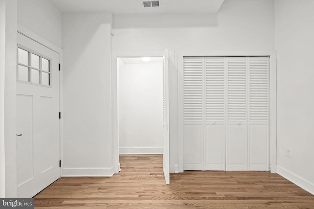 interior space with a closet and light wood-type flooring