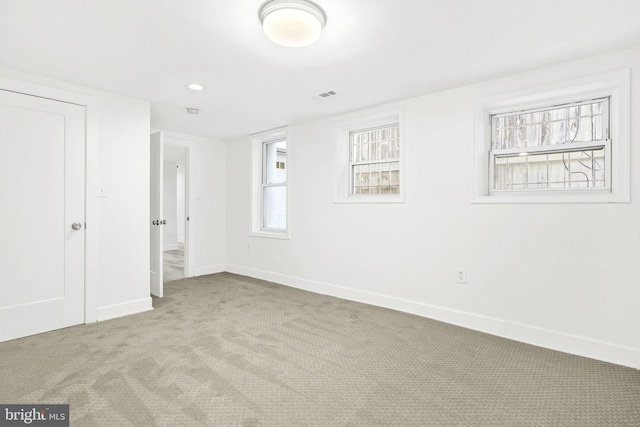 unfurnished bedroom featuring light colored carpet