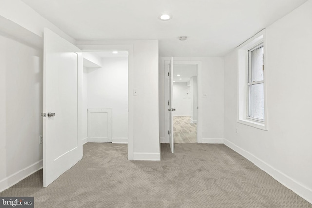 unfurnished bedroom with light carpet