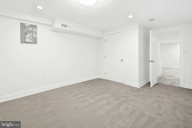 interior space featuring carpet floors, electric panel, and a closet