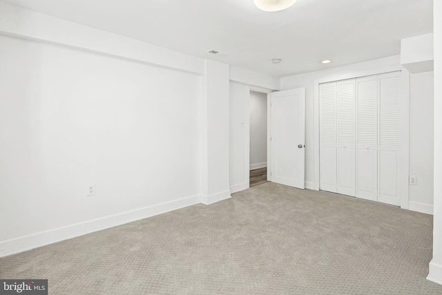 unfurnished bedroom with light colored carpet