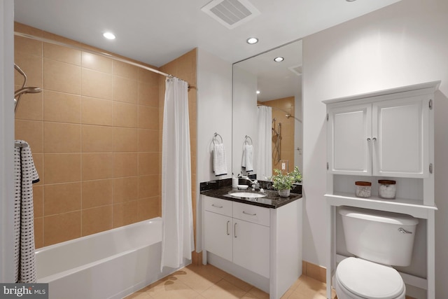 full bathroom featuring tile patterned flooring, shower / tub combo, vanity, and toilet