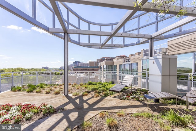 view of patio / terrace with a wooden deck and a pergola