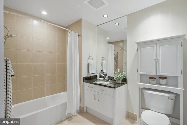 full bathroom with vanity, shower / bath combination with curtain, tile patterned floors, and toilet