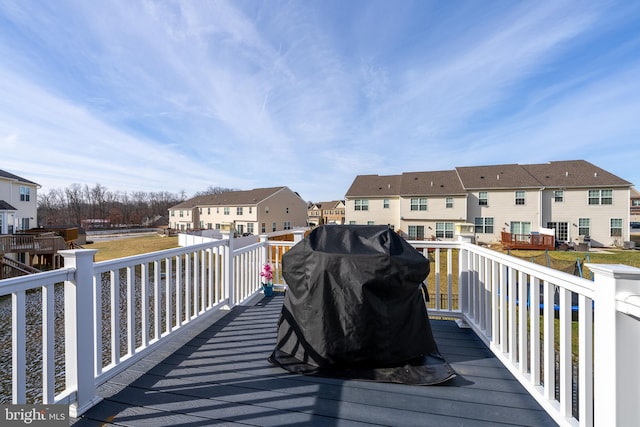 wooden deck featuring area for grilling