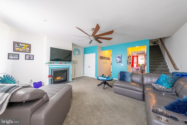 living room with light colored carpet and ceiling fan