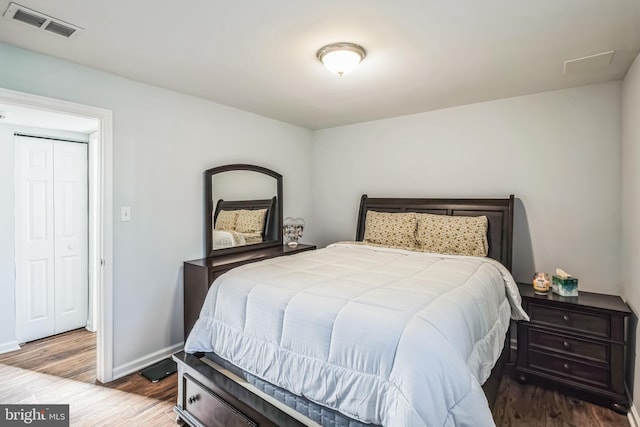 bedroom with hardwood / wood-style flooring