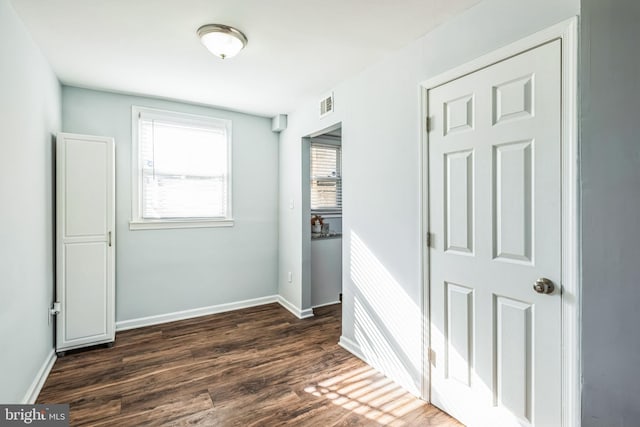 interior space with dark hardwood / wood-style floors