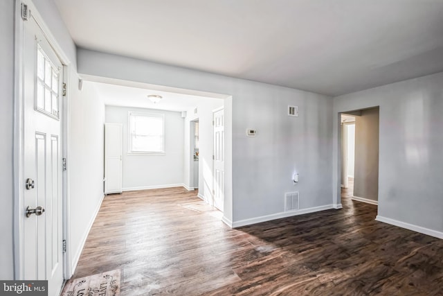 empty room featuring dark wood-type flooring