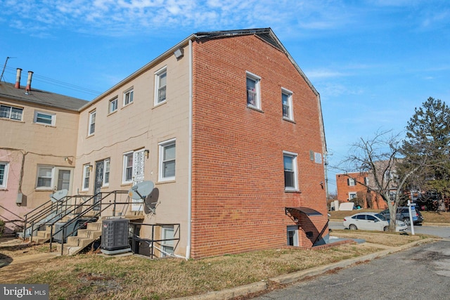 view of property exterior with central air condition unit