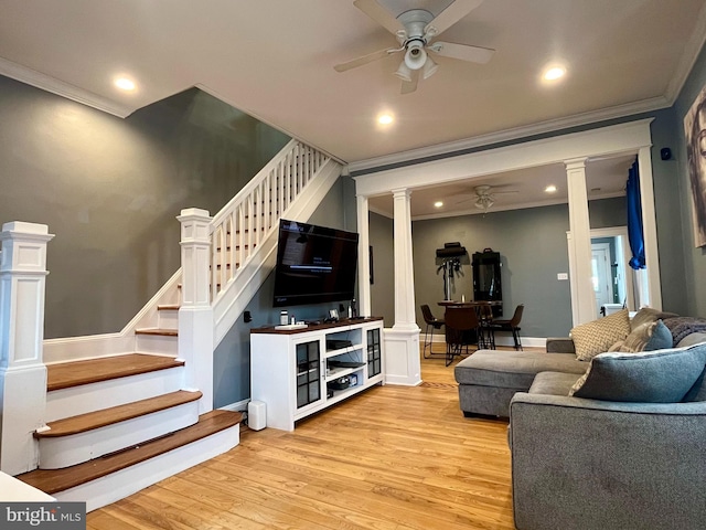 living room with crown molding, light hardwood / wood-style flooring, decorative columns, and ceiling fan