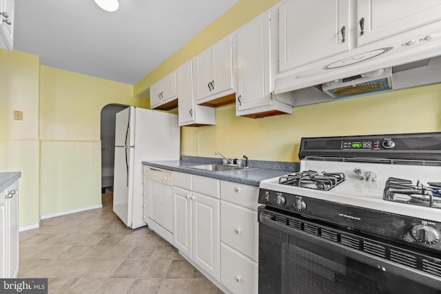 kitchen with sink, white appliances, and white cabinets